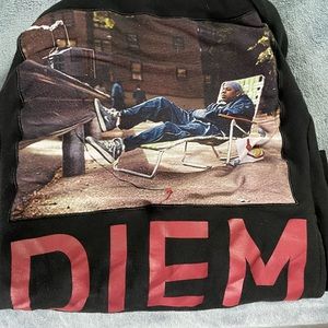 This is a Diem designed hoodie. The front patch is sewn on. It is was worn a lot